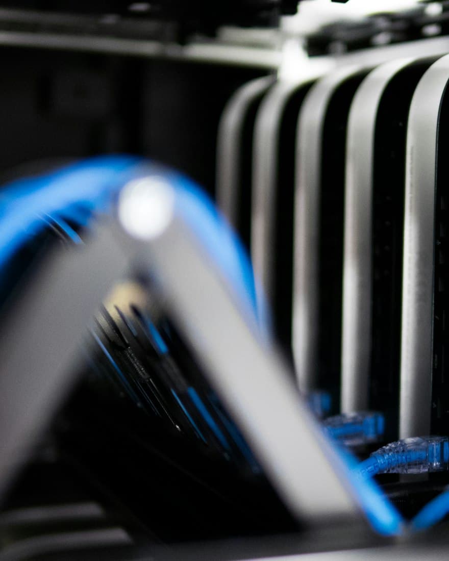 Blue network cables plugged into a server rack