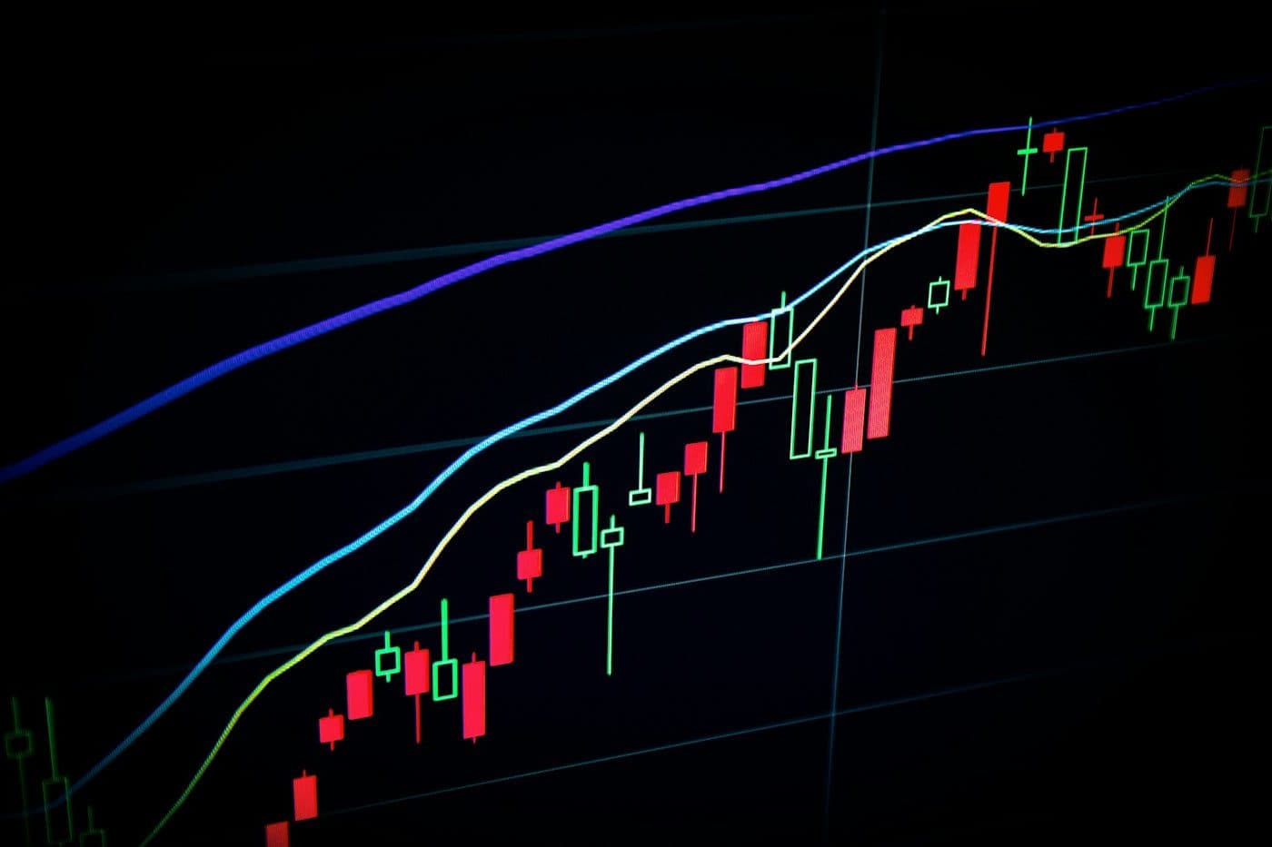 A candlestick price chart glowing on a dark trading screen